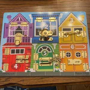 Melissa & Doug Latch & Lock puzzle.